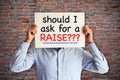 Employee asking ÃÂ¢Ã¢âÂ¬Ãâshould I ask for a raiseÃÂ¢Ã¢âÂ¬ÃÂ, salary increase or negotiation concept Royalty Free Stock Photo